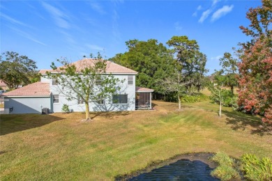 This light-filled home boasts beautiful views from the side of on Tuscawilla Country Club in Florida - for sale on GolfHomes.com, golf home, golf lot