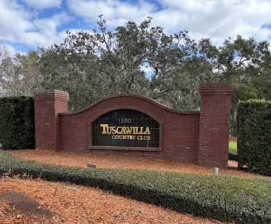 This light-filled home boasts beautiful views from the side of on Tuscawilla Country Club in Florida - for sale on GolfHomes.com, golf home, golf lot