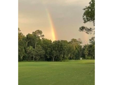 This light-filled home boasts beautiful views from the side of on Tuscawilla Country Club in Florida - for sale on GolfHomes.com, golf home, golf lot