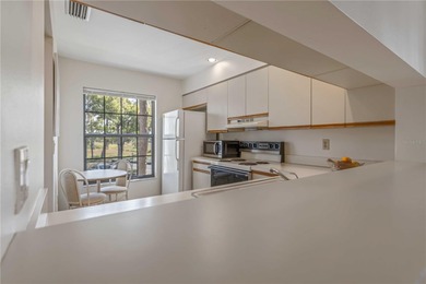 Discover the charm of this lovingly maintained end-unit condo in on The Meadows Golf and Country Club in Florida - for sale on GolfHomes.com, golf home, golf lot