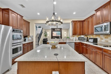 This 6-bedroom, 3.5-bath pool home in the gated North Shore at on North Shore Golf Club in Florida - for sale on GolfHomes.com, golf home, golf lot