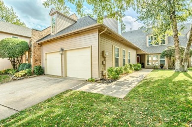 Perched on a beautiful tree-lined street in gated The Highlands on Oak Tree National Golf and Country Club in Oklahoma - for sale on GolfHomes.com, golf home, golf lot