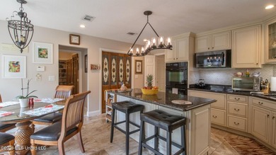 Located in the heart of Diamondhead, this spacious home sits on on Diamondhead Country Club in Mississippi - for sale on GolfHomes.com, golf home, golf lot