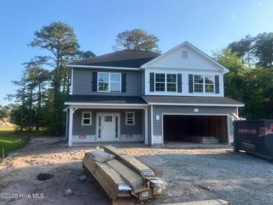 Welcome to 1430 Mona Passage Court, a delightful two-story home on Harbour Point Golf Club in North Carolina - for sale on GolfHomes.com, golf home, golf lot