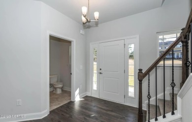 Welcome to 1430 Mona Passage Court, a delightful two-story home on Harbour Point Golf Club in North Carolina - for sale on GolfHomes.com, golf home, golf lot