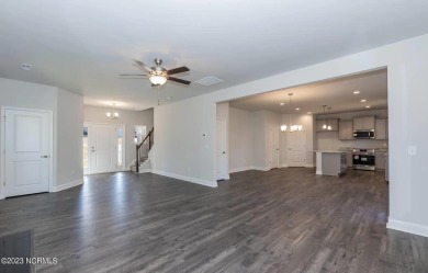 Welcome to 1430 Mona Passage Court, a delightful two-story home on Harbour Point Golf Club in North Carolina - for sale on GolfHomes.com, golf home, golf lot