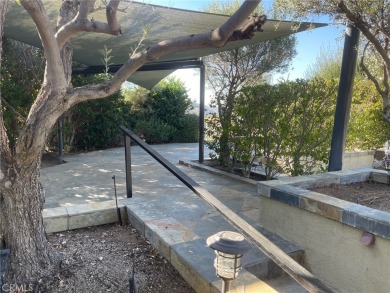 Massive Lot with all Slate Tile, Double Sided Fireplace and TV on Rancho California RV Resort in California - for sale on GolfHomes.com, golf home, golf lot