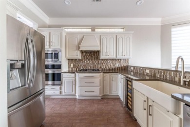 This charming 4-bedroom, 2.5-bath home overlooking the 15th tee on Thorntree Country Club in Texas - for sale on GolfHomes.com, golf home, golf lot