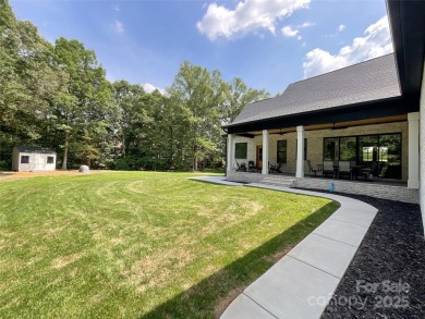 Discover this stunning custom-built farmhouse nestled on 3.27 on Eagle Chase Golf Club in North Carolina - for sale on GolfHomes.com, golf home, golf lot