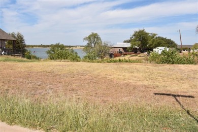 Build your dream house on a lot with beautiful views of the lake on Stewart Peninsula Golf Course in Texas - for sale on GolfHomes.com, golf home, golf lot