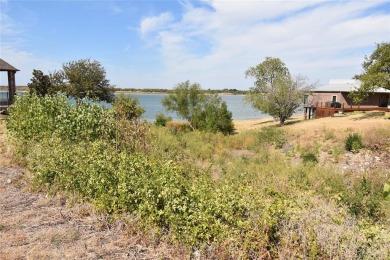 Build your dream house on a lot with beautiful views of the lake on Stewart Peninsula Golf Course in Texas - for sale on GolfHomes.com, golf home, golf lot