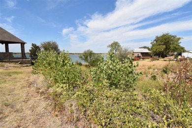 Build your dream house on a lot with beautiful views of the lake on Stewart Peninsula Golf Course in Texas - for sale on GolfHomes.com, golf home, golf lot
