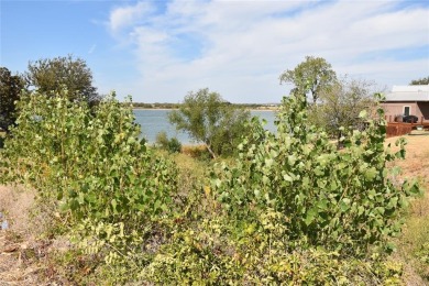 Build your dream house on a lot with beautiful views of the lake on Stewart Peninsula Golf Course in Texas - for sale on GolfHomes.com, golf home, golf lot