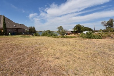 Build your dream house on a lot with beautiful views of the lake on Stewart Peninsula Golf Course in Texas - for sale on GolfHomes.com, golf home, golf lot