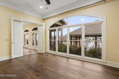 Experience waterfront living at its finest in Lake Caroline with on Lake Caroline Golf Club in Mississippi - for sale on GolfHomes.com, golf home, golf lot