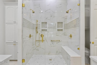 Experience waterfront living at its finest in Lake Caroline with on Lake Caroline Golf Club in Mississippi - for sale on GolfHomes.com, golf home, golf lot