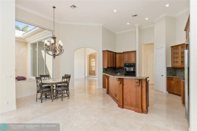 Step into luxury as you enter this estate home, where 14' volume on Heron Bay Golf Club in Florida - for sale on GolfHomes.com, golf home, golf lot