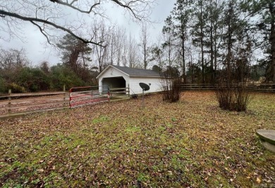 This spacious and charming 4 Bedroom 2 Bath home sits on just on Camden Country Club in Arkansas - for sale on GolfHomes.com, golf home, golf lot