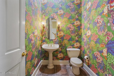 Experience waterfront living at its finest in Lake Caroline with on Lake Caroline Golf Club in Mississippi - for sale on GolfHomes.com, golf home, golf lot