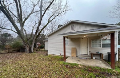 This spacious and charming 4 Bedroom 2 Bath home sits on just on Camden Country Club in Arkansas - for sale on GolfHomes.com, golf home, golf lot