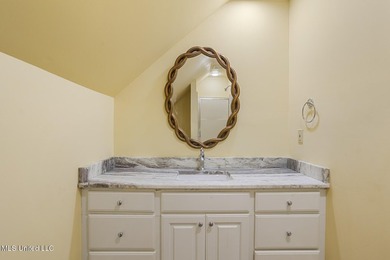 Experience waterfront living at its finest in Lake Caroline with on Lake Caroline Golf Club in Mississippi - for sale on GolfHomes.com, golf home, golf lot