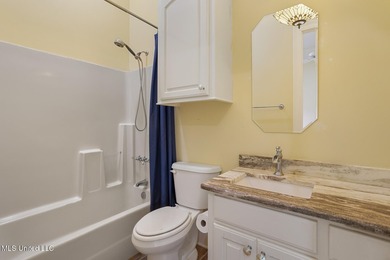 Experience waterfront living at its finest in Lake Caroline with on Lake Caroline Golf Club in Mississippi - for sale on GolfHomes.com, golf home, golf lot