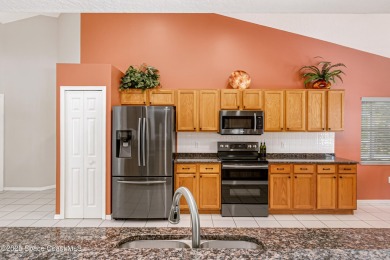 Discover the perfect blend of comfort  privacy in this on Baytree National Golf Links in Florida - for sale on GolfHomes.com, golf home, golf lot