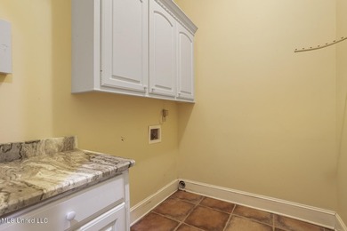 Experience waterfront living at its finest in Lake Caroline with on Lake Caroline Golf Club in Mississippi - for sale on GolfHomes.com, golf home, golf lot