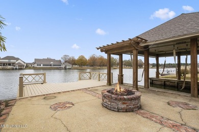 Experience waterfront living at its finest in Lake Caroline with on Lake Caroline Golf Club in Mississippi - for sale on GolfHomes.com, golf home, golf lot