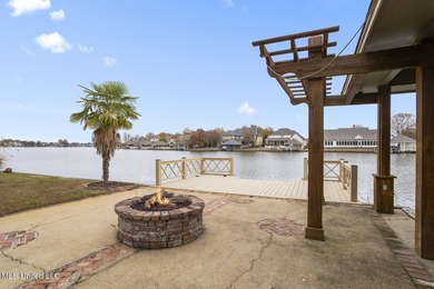 Experience waterfront living at its finest in Lake Caroline with on Lake Caroline Golf Club in Mississippi - for sale on GolfHomes.com, golf home, golf lot