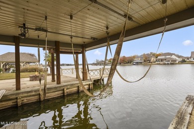 Experience waterfront living at its finest in Lake Caroline with on Lake Caroline Golf Club in Mississippi - for sale on GolfHomes.com, golf home, golf lot