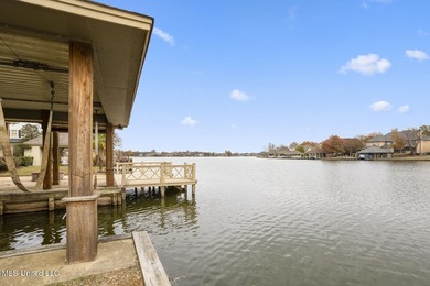 Experience waterfront living at its finest in Lake Caroline with on Lake Caroline Golf Club in Mississippi - for sale on GolfHomes.com, golf home, golf lot