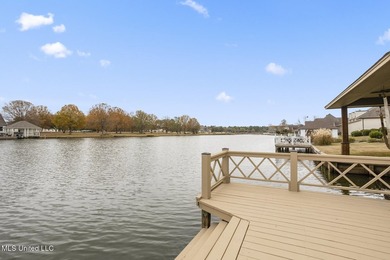 Experience waterfront living at its finest in Lake Caroline with on Lake Caroline Golf Club in Mississippi - for sale on GolfHomes.com, golf home, golf lot