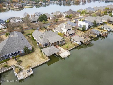 Experience waterfront living at its finest in Lake Caroline with on Lake Caroline Golf Club in Mississippi - for sale on GolfHomes.com, golf home, golf lot