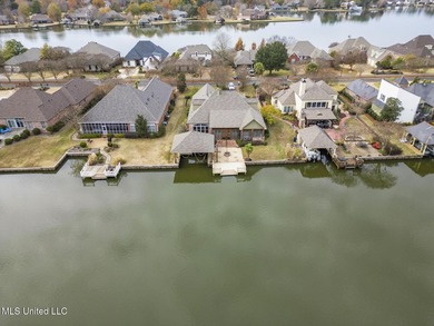 Experience waterfront living at its finest in Lake Caroline with on Lake Caroline Golf Club in Mississippi - for sale on GolfHomes.com, golf home, golf lot