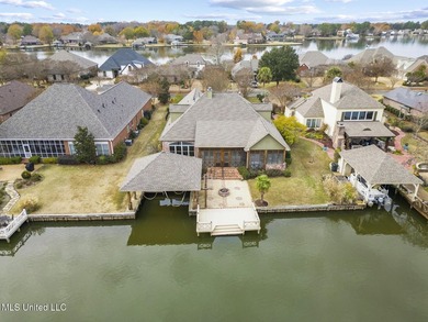 Experience waterfront living at its finest in Lake Caroline with on Lake Caroline Golf Club in Mississippi - for sale on GolfHomes.com, golf home, golf lot