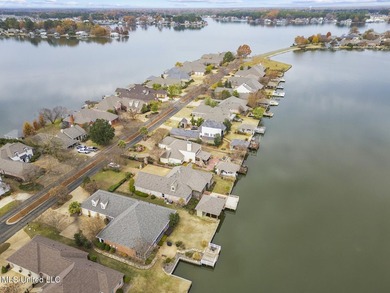 Experience waterfront living at its finest in Lake Caroline with on Lake Caroline Golf Club in Mississippi - for sale on GolfHomes.com, golf home, golf lot