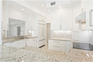 TASTEFULLY RENOVATED TOP FLOOR CORNER CONDO IN MAYFAIR HOUSE on Oak Harbor Country Club in Florida - for sale on GolfHomes.com, golf home, golf lot