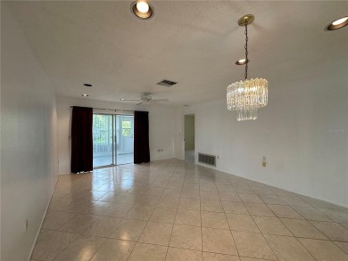 Enjoy the ease of maintenance-free living in this charming and on Beacon Woods Golf Club in Florida - for sale on GolfHomes.com, golf home, golf lot