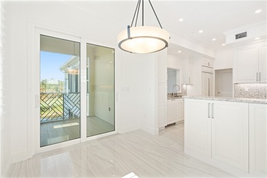 TASTEFULLY RENOVATED TOP FLOOR CORNER CONDO IN MAYFAIR HOUSE on Oak Harbor Country Club in Florida - for sale on GolfHomes.com, golf home, golf lot