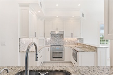 TASTEFULLY RENOVATED TOP FLOOR CORNER CONDO IN MAYFAIR HOUSE on Oak Harbor Country Club in Florida - for sale on GolfHomes.com, golf home, golf lot