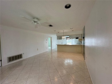 Enjoy the ease of maintenance-free living in this charming and on Beacon Woods Golf Club in Florida - for sale on GolfHomes.com, golf home, golf lot