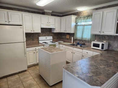 Welcome to this this 2 bd / 2 bath with plenty of space and on Spanish Lakes Fairways in Florida - for sale on GolfHomes.com, golf home, golf lot