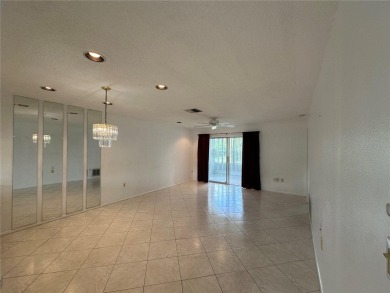 Enjoy the ease of maintenance-free living in this charming and on Beacon Woods Golf Club in Florida - for sale on GolfHomes.com, golf home, golf lot