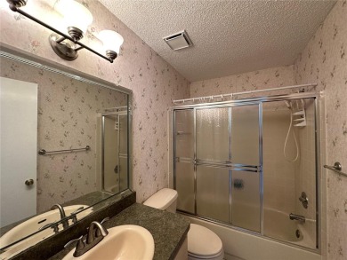 Enjoy the ease of maintenance-free living in this charming and on Beacon Woods Golf Club in Florida - for sale on GolfHomes.com, golf home, golf lot