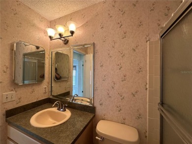 Enjoy the ease of maintenance-free living in this charming and on Beacon Woods Golf Club in Florida - for sale on GolfHomes.com, golf home, golf lot