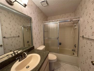 Enjoy the ease of maintenance-free living in this charming and on Beacon Woods Golf Club in Florida - for sale on GolfHomes.com, golf home, golf lot