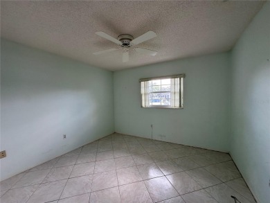 Enjoy the ease of maintenance-free living in this charming and on Beacon Woods Golf Club in Florida - for sale on GolfHomes.com, golf home, golf lot
