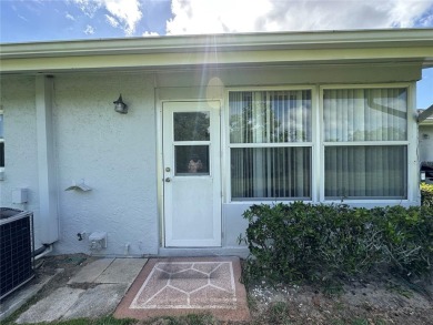 Enjoy the ease of maintenance-free living in this charming and on Beacon Woods Golf Club in Florida - for sale on GolfHomes.com, golf home, golf lot
