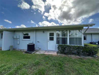 Enjoy the ease of maintenance-free living in this charming and on Beacon Woods Golf Club in Florida - for sale on GolfHomes.com, golf home, golf lot